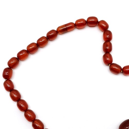 633 - Strand of graduated amber beads - 52cm & 45g ~ clasp secures but is a/f