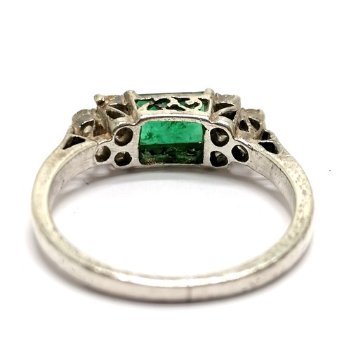 652 - Emerald & diamond ring set in white metal (silver?) - size N & 2.5g total weight - SOLD ON BEHALF OF... 