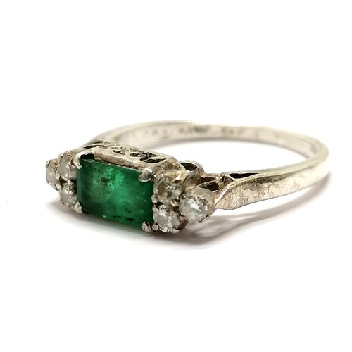 652 - Emerald & diamond ring set in white metal (silver?) - size N & 2.5g total weight - SOLD ON BEHALF OF... 