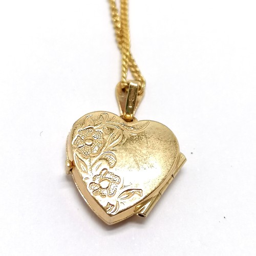 660 - 9ct hallmarked gold heart shaped locket pendant with engraved detail to front on a 9ct hallmarked go... 