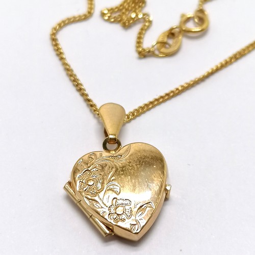 660 - 9ct hallmarked gold heart shaped locket pendant with engraved detail to front on a 9ct hallmarked go... 