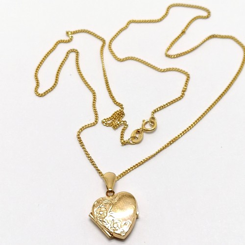 660 - 9ct hallmarked gold heart shaped locket pendant with engraved detail to front on a 9ct hallmarked go... 