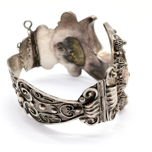 668 - Antique ethnic unmarked silver bangle with crescent & script centre detail - 7cm across & 43g ~ slig... 