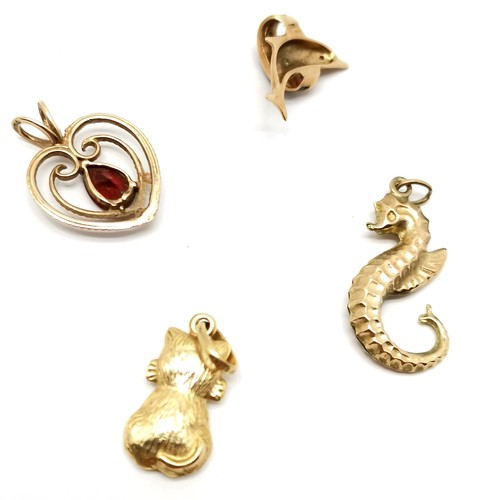 687 - 4 x 9ct marked gold pendants - seahorse, cat, heart & dolphin set with sapphire / diamond - total we... 