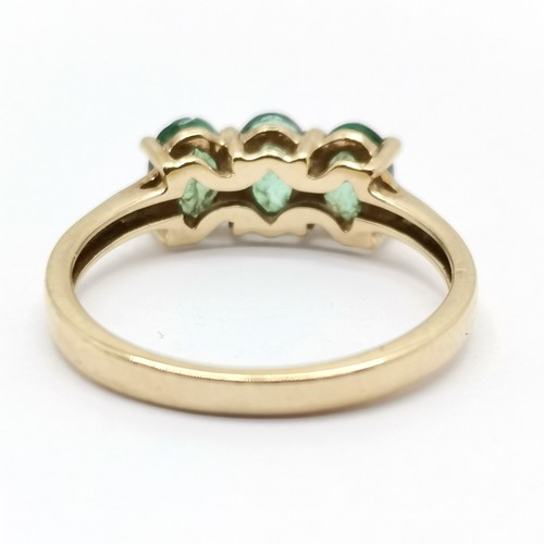 692 - 9ct hallmarked gold 3 stone emerald ring with diamond set shoulders - size L½ & 1.9g total weight