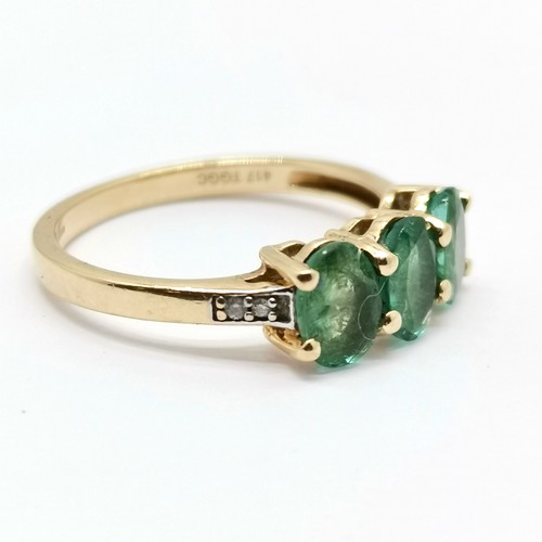 692 - 9ct hallmarked gold 3 stone emerald ring with diamond set shoulders - size L½ & 1.9g total weight