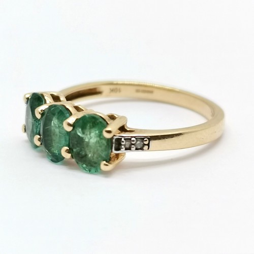 692 - 9ct hallmarked gold 3 stone emerald ring with diamond set shoulders - size L½ & 1.9g total weight