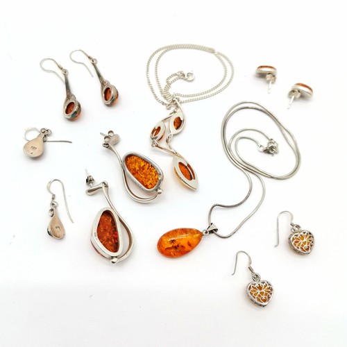 713 - Qty of silver amber set jewellery inc large pair of 5cm drop earrings, pendants on chains etc - tota... 