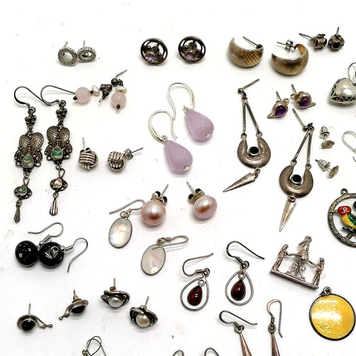 779 - 28 x pairs of silver earrings (some stone set) t/w qty of silver pendants inc yellow enamel St Chris... 