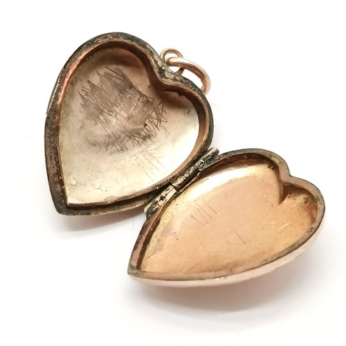 789 - Rose gold marked heart shaped locket with engraved detail - 2.5cm drop & 2.2g total weight ~ some de... 