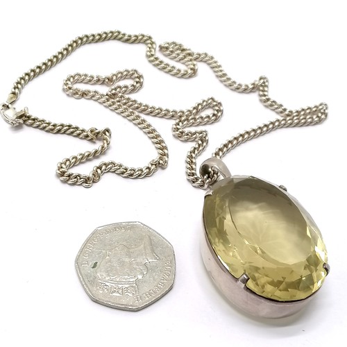 793 - Large citrine stone set unmarked silver pendant (42mm x 31mm) on silver 55cm chain - total weight 59... 