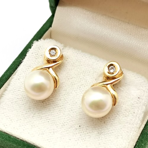 811 - 18ct marked gold good quality pearl & diamond set earrings marked PM B1 - 1.4cm drop & 4.5g total we... 