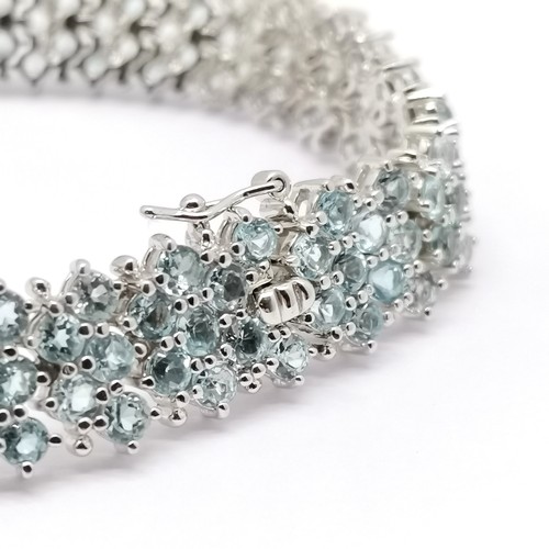 818 - Silver bracelet set with 154 blue topaz stones - 18cm & 29g total weight