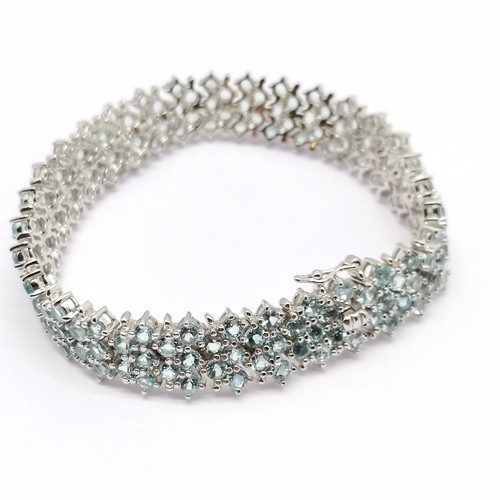 818 - Silver bracelet set with 154 blue topaz stones - 18cm & 29g total weight