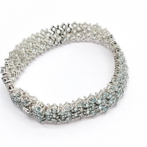 818 - Silver bracelet set with 154 blue topaz stones - 18cm & 29g total weight