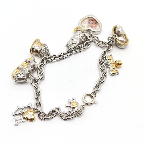 825 - Silver cat themed charm bracelet with charms inc cat photo frame, Purr, cat in basket etc - total we... 