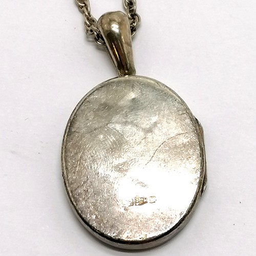 859 - Antique Chester silver oval locket pendant (5cm) on silver marked 56cm chain - 22g & some dents to r... 