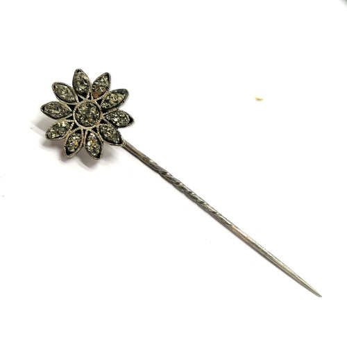 871 - Unmarked white metal flower stick pin set with fools gold in original C & R Winter (Preston) retail ... 