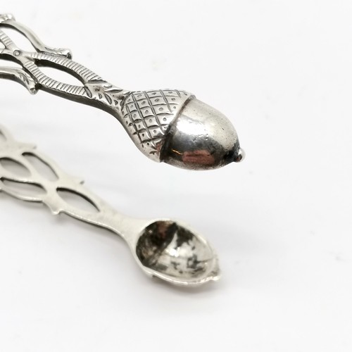 930 - 3 x silver items - Georgian pair of sugar tongs with acorn bowls, spoon with Bavaria 1771 thaler coi... 