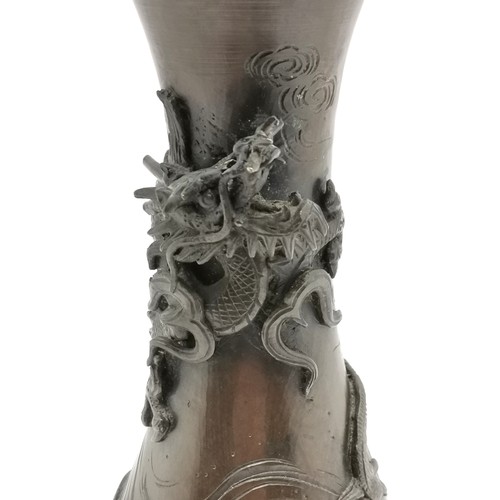 41 - Oriental Japanese antique bronze vase with dragon detail in relief terminating on 3 feet - 27cm high