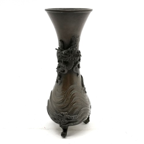 41 - Oriental Japanese antique bronze vase with dragon detail in relief terminating on 3 feet - 27cm high