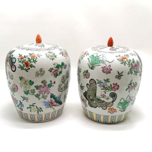 46 - Pair of famille rose lidded jars 30cm high with character marks to the base of one - no obvious dama... 