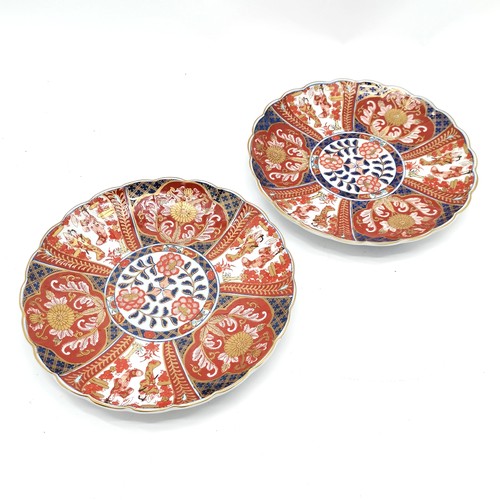 53 - Pair of Oriental Imari patterned chargers with chrysantheum & panel detail - 31cm diameter