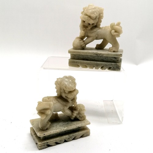 65 - Pair of Chinese carved soapstone lion dogs - 11cm high x 9cm x 5cm ~ both have some dints