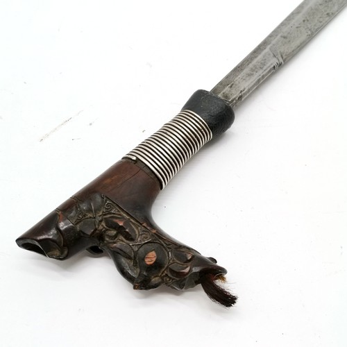 69 - 19th century Borneo dayak mandau sword with wooden carved hilt with unmarked silver wire detail to h... 