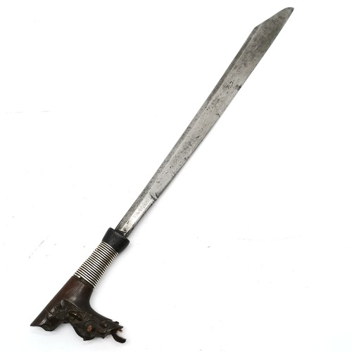 69 - 19th century Borneo dayak mandau sword with wooden carved hilt with unmarked silver wire detail to h... 