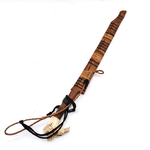 70 - Borneo dayak mandau sword in scabbard - with a carved stag horn hilt - total length 70cm