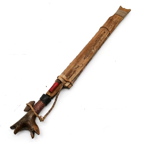 73 - Vintage Borneo dayak mandau sword in sheath with pisau raut in back sheath ~ the sword has hardwood ... 