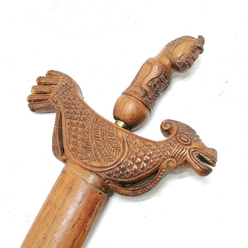 93 - Antique Javan madura kris / keris with ogre detail handle in a carved wooden sheath with zoomorphic ... 