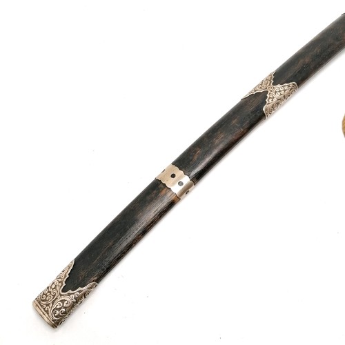 103 - Antique Burmese / Asian Mandalay region sword with unmarked silver mounts & inlay to blade in an ebo... 