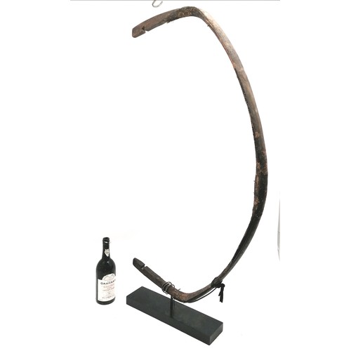 106 - Manchurian Chinese 18th century recurve bow mounted on a black stand, has part of the import seal re... 