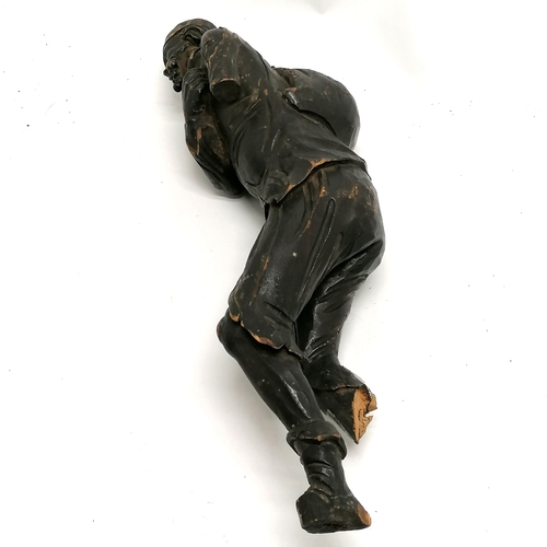 167 - Antique carved wooden figure of an eastern gentleman carrying a sack - 44cm high - has obvious losse... 