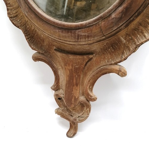 195 - Antique mahogany carved mirror ( was originally a barometer case) 115cm long x 48cm wide