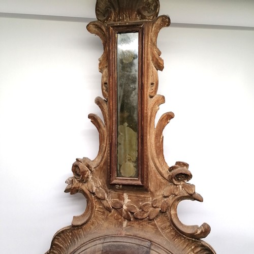 195 - Antique mahogany carved mirror ( was originally a barometer case) 115cm long x 48cm wide