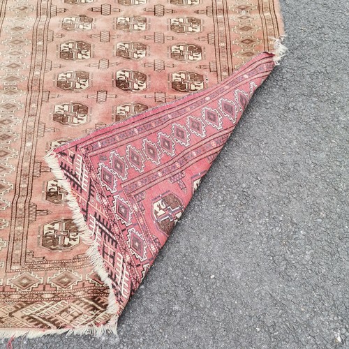 241 - Red grounded hand woven rug with repeat geometric pattern - 120cm x 150cm ~ has losses