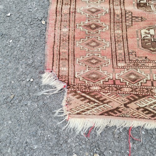 241 - Red grounded hand woven rug with repeat geometric pattern - 120cm x 150cm ~ has losses