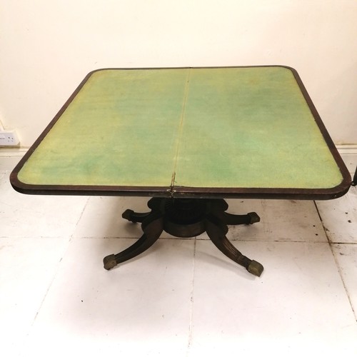 246 - Antique mahogany fold over card table with pedestal base terminating on 4 sabre legs with the origin... 