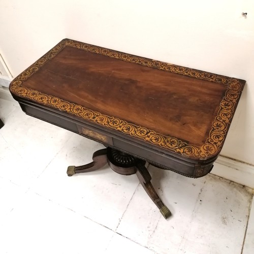 246 - Antique mahogany fold over card table with pedestal base terminating on 4 sabre legs with the origin... 