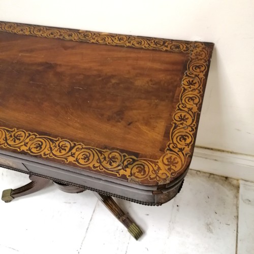 246 - Antique mahogany fold over card table with pedestal base terminating on 4 sabre legs with the origin... 