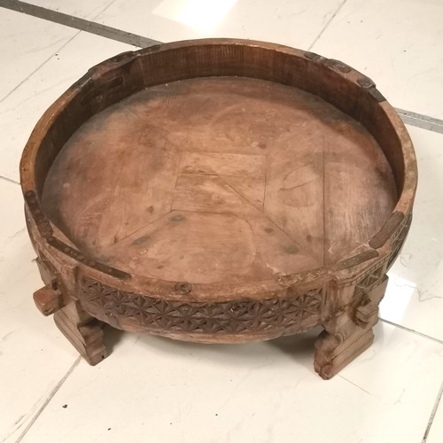 256 - Antique Indian chakki style coffee table with iron fittings on 4 legs - 69cm diameter