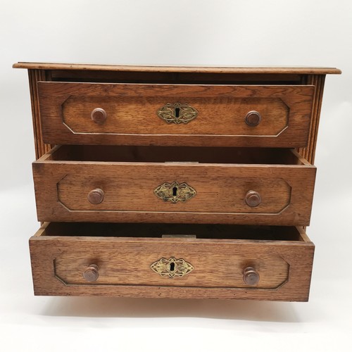 257 - Continental oak 3 drawer cabinet on bracket feet with brass escutcheons and reeded detail - 50cm x 3... 