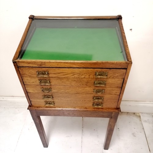 304 - Antique oak 5 drawer collectors cabinet with glazed sloping top with Art Nouveau brass handles on 4 ... 