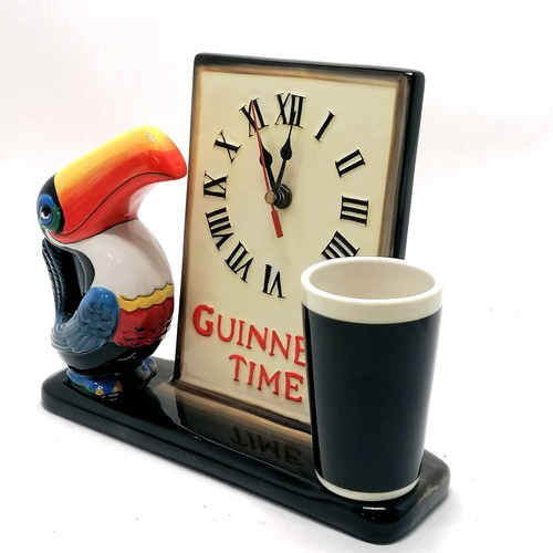 318 - Guinness Time porcelain clock with toucan & glass detail - 21cm high x 26cm and in running order at ... 