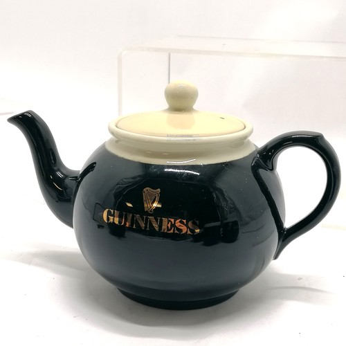 319 - Guinness Carlton ware 3 piece teaset with 2 mugs & 2 miniatures (8.5cm) & 2 badges