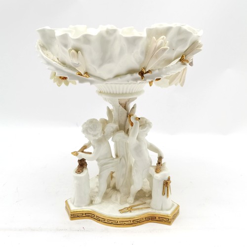 348 - Antique porcelain table centrepiece with 3 cupids forging arrows detail by Moore - 29cm high ~ with ... 