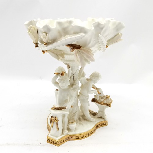 348 - Antique porcelain table centrepiece with 3 cupids forging arrows detail by Moore - 29cm high ~ with ... 